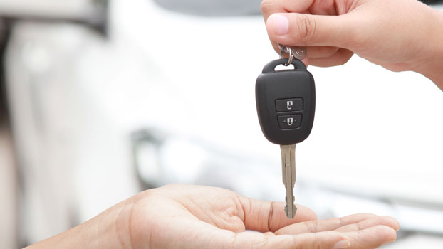 Owner gives to his car key to the dealer